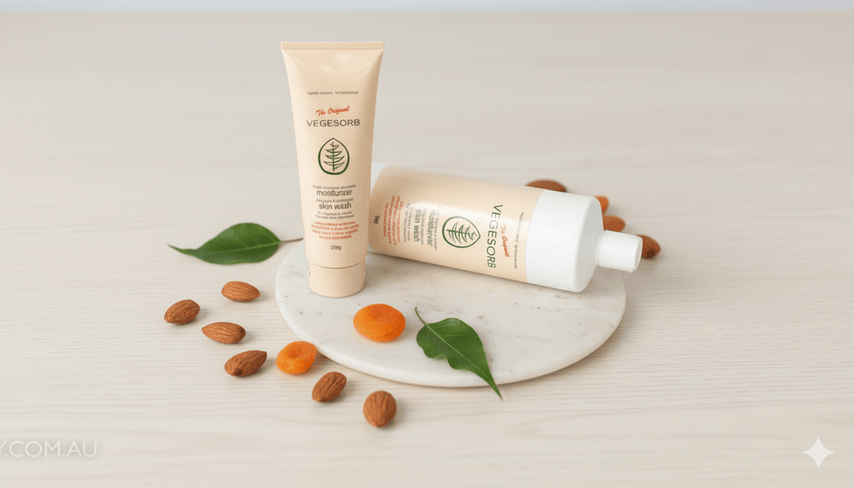 Vegesorb Sorbolene Alternative cream and skin wash with almonds, apricot kernels, and green leaves on a white marble board