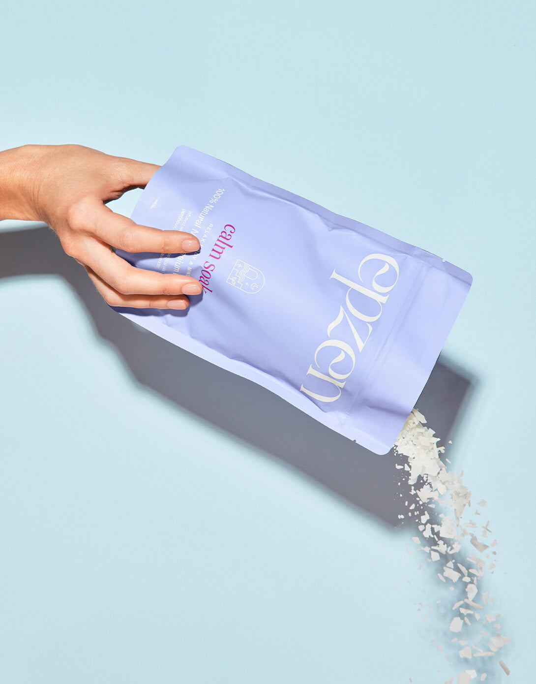 Epzen Calm Soak magnesium flakes being poured from the pouch