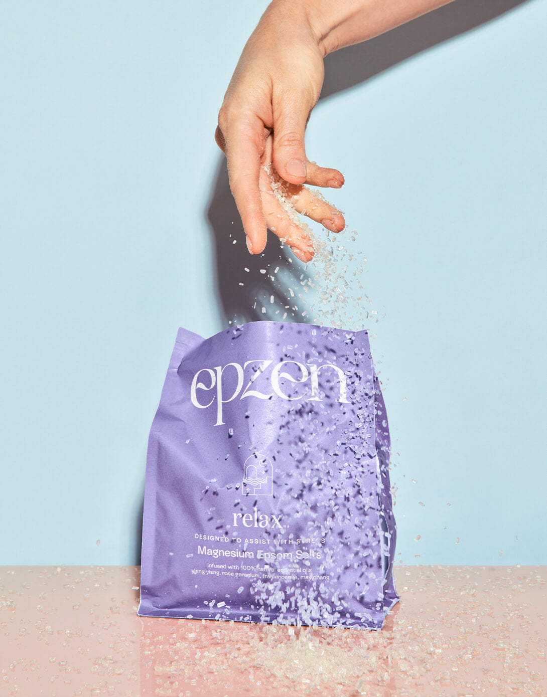 Epzen Relax Epsom salt crystals being poured from the pouch