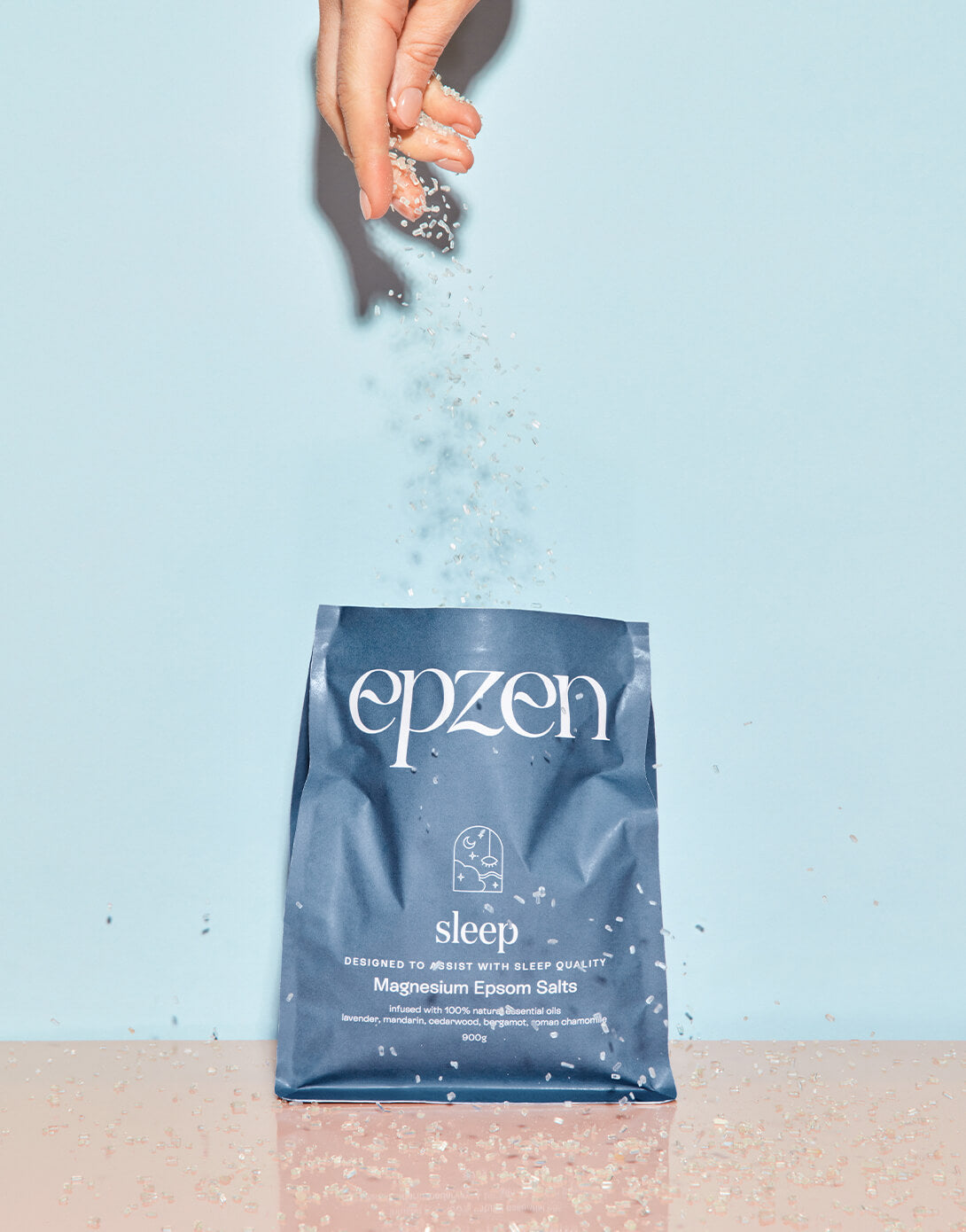 Epzen Sleep magnesium bath crystals being poured from the pouch