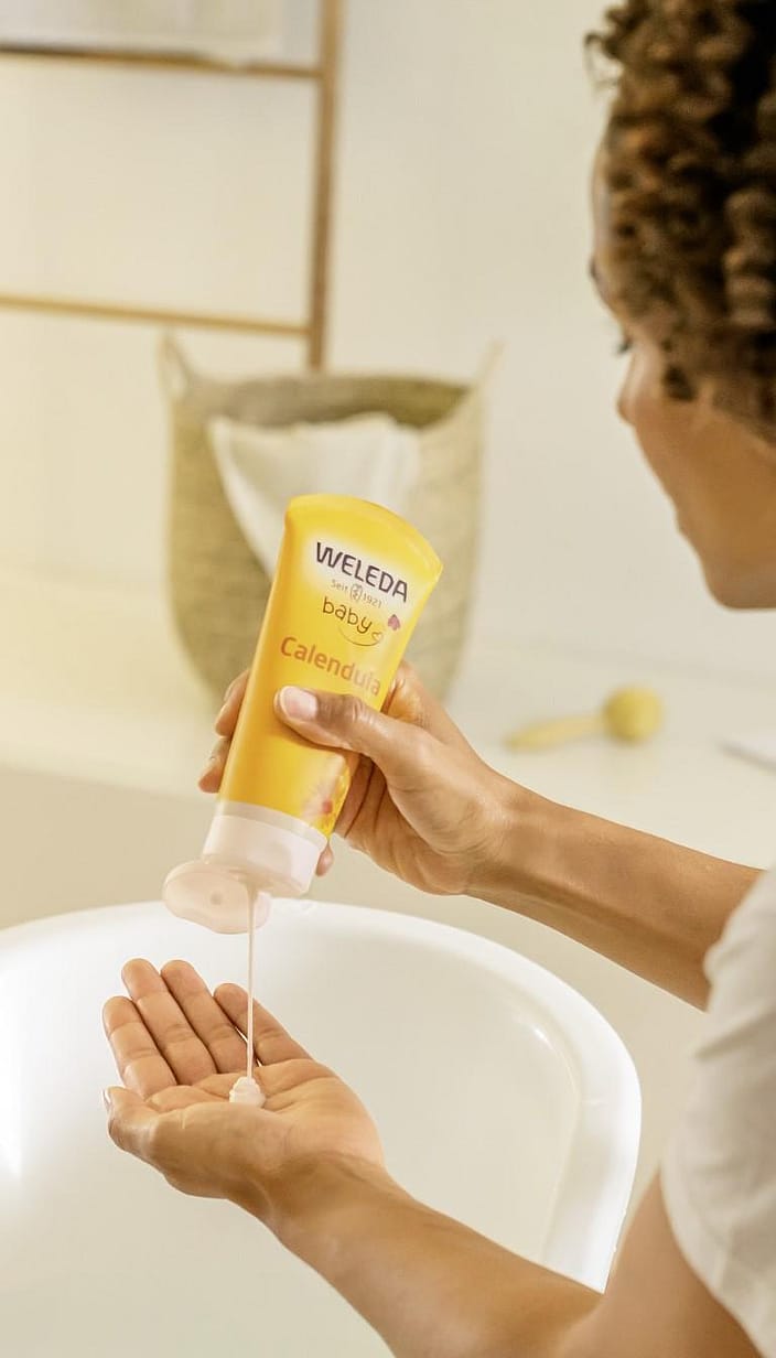 Weleda Calendula Shampoo and Body Wash dispensed into the hand