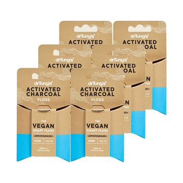 Six Dr. Tung's Smart Vegan Activated Charcoal Dental Floss 27m dispensers on a white background