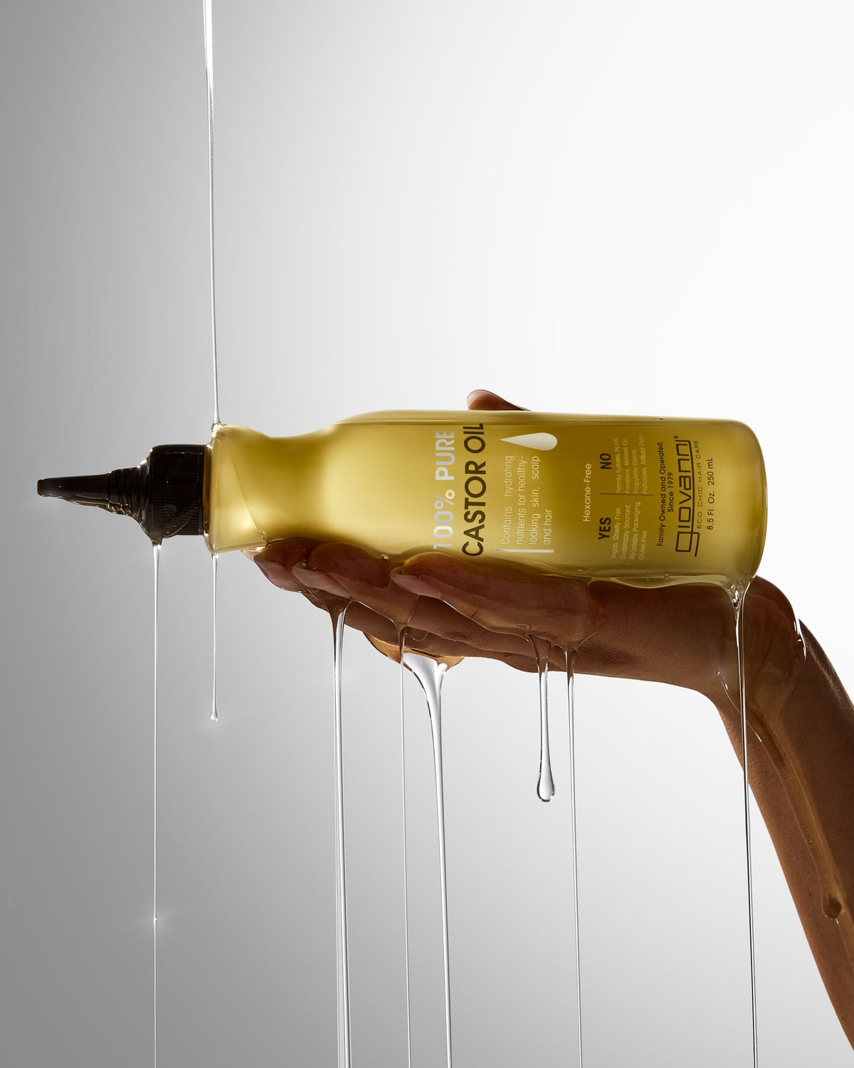 Giovanni 100% Pure Castor Oil 250ml dispensing from its pointed applicator