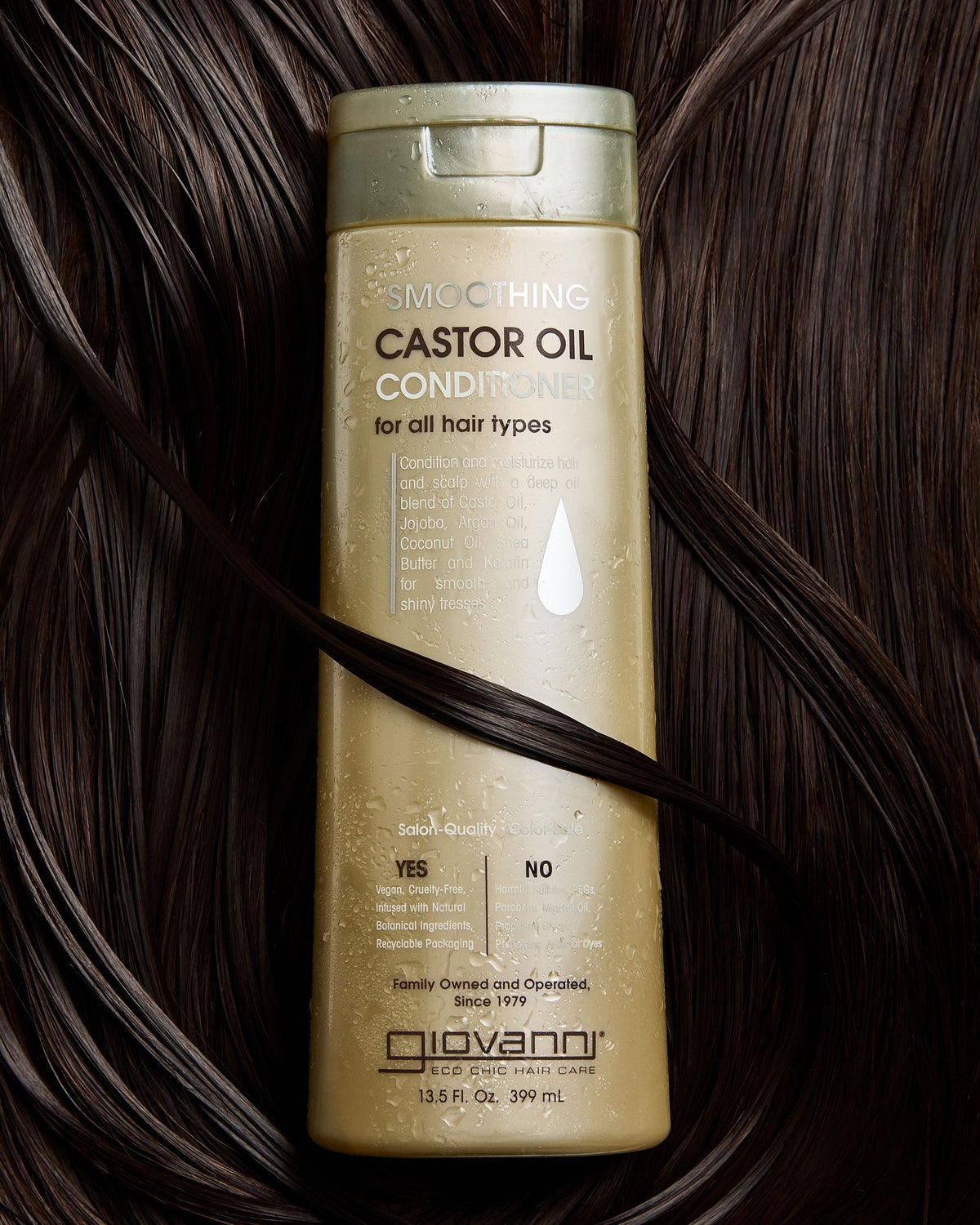 Giovanni Smoothing Castor Oil Conditioner 399ml resting on hair
