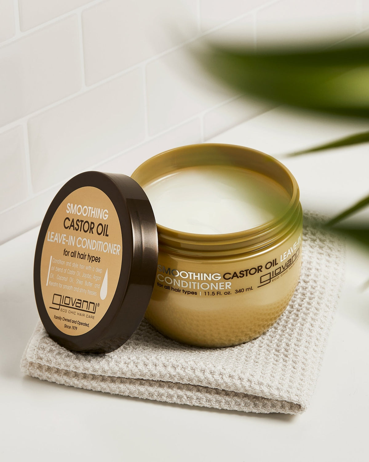Open Giovanni Smoothing Castor Oil Leave-In Conditioner 340ml showing its texture