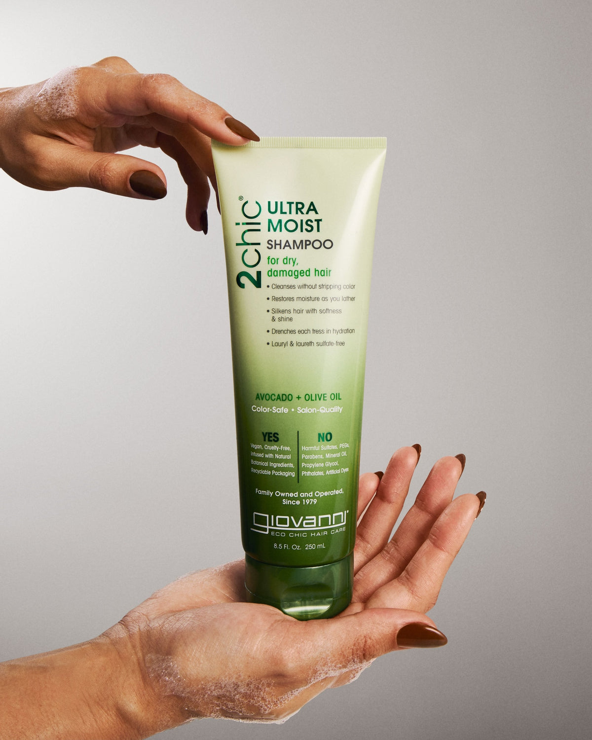 Giovanni 2chic Ultra Moist Shampoo 250ml held between hands