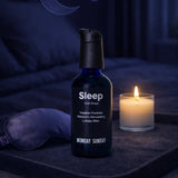 Monday Sunday Sleep Oral Drops bottle beside an eye mask and candle